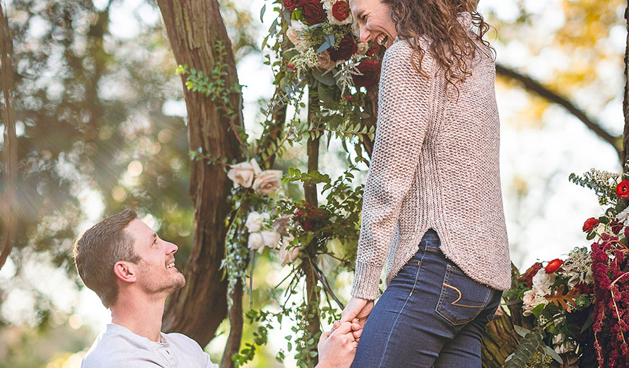 Newly engaged couple smiling