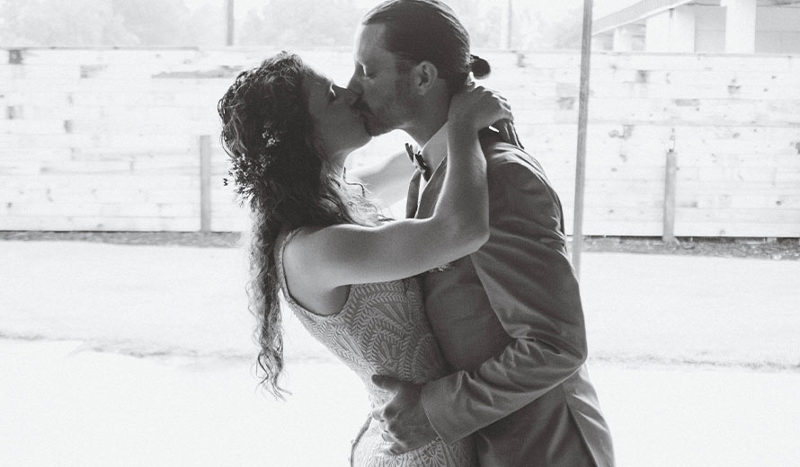 Newlyweds kissing